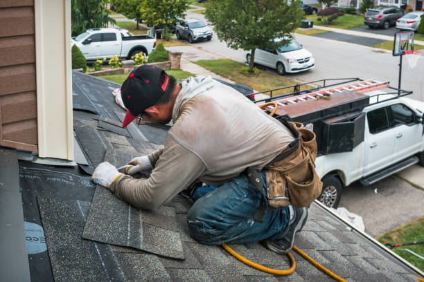 Professional Flat Roof Repair technician working in South Beach, OR